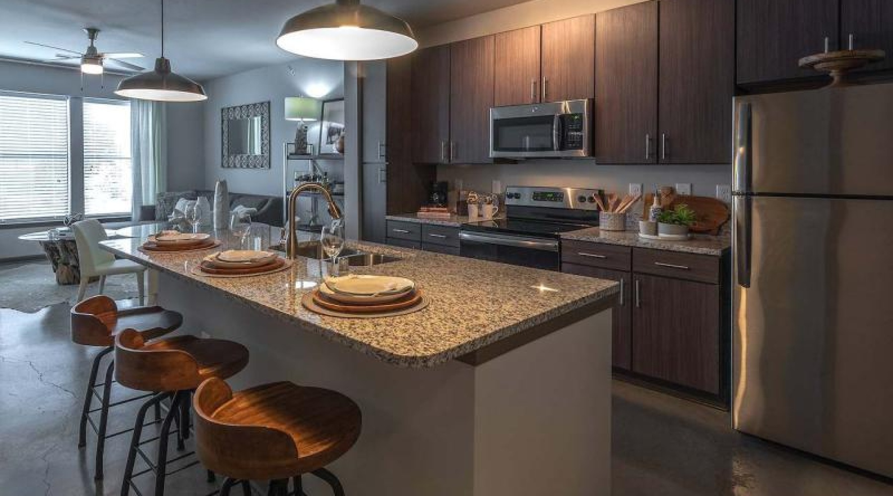 a kitchen with wood cabinets and stainless steel appliances